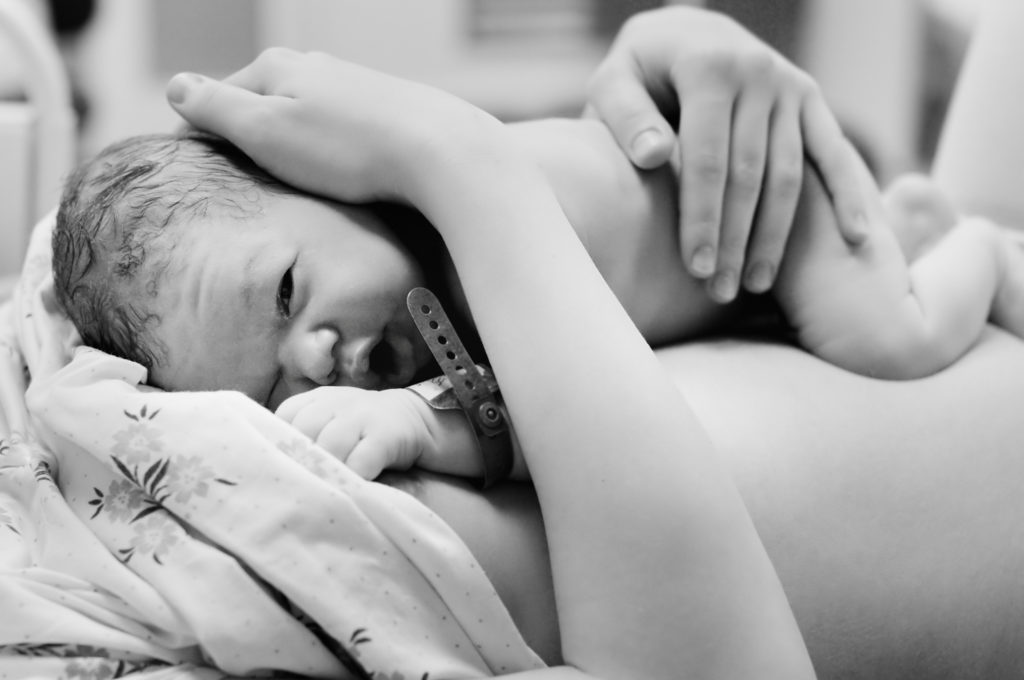baby on mother's chest